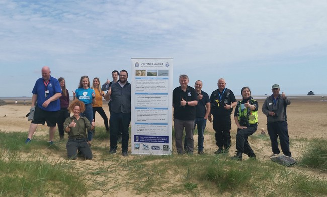 Operation Seabird team out on the sand dunes.