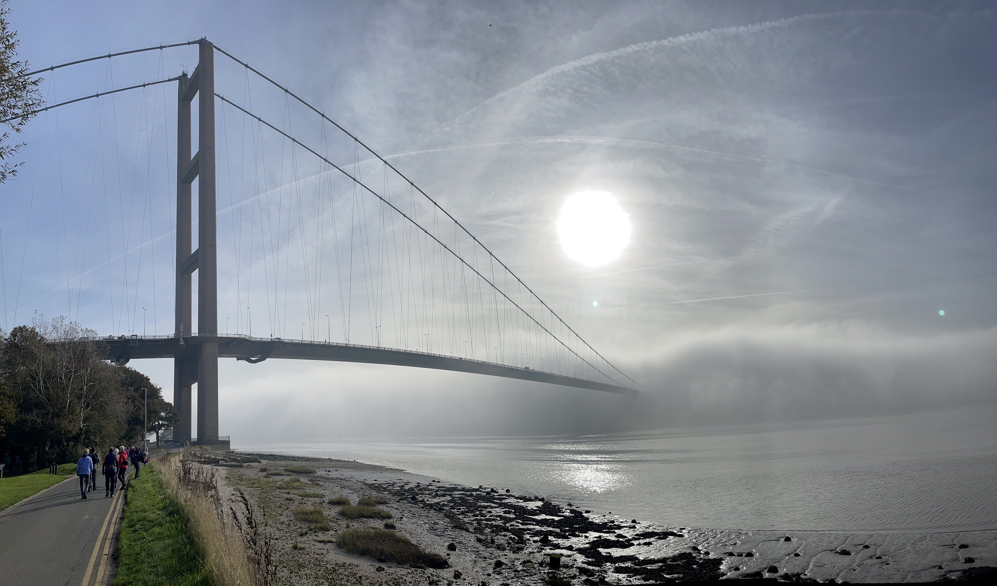 The Humber Bridge partly hidden in some fog.